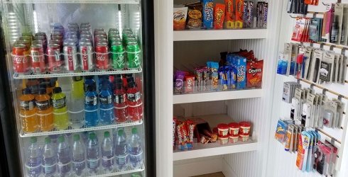 Drink fridge and snack station in cafe